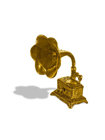 Gold old gramophone (figurine), isolated on whiteの写真素材