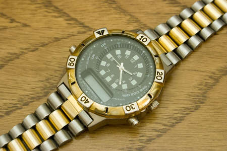 Watch on wooden background