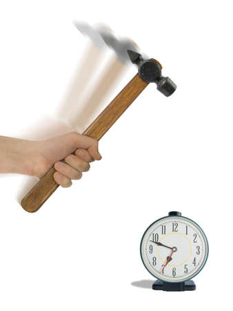 Alarm clock and hammer in hand, isolated on white (clipping path for hand and clock)の写真素材
