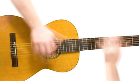 Classical acoustic guitar and hands (slow motion) of musician, on white backgroundの写真素材