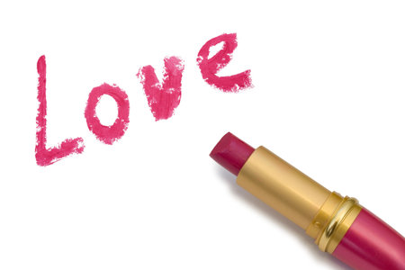 Word Love and lipstick, isolated on white backgroundの写真素材