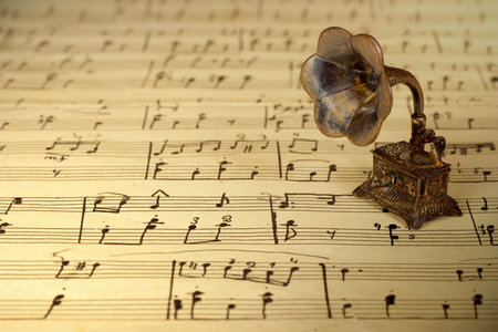 Gramophone on old sheet music, retro backgroundの写真素材