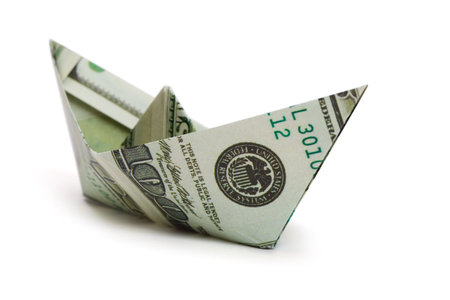 Ship made of money, isolated on white backgroundの写真素材