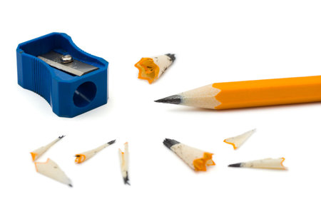 Pencil sharpener and cuttings, isolated on white background