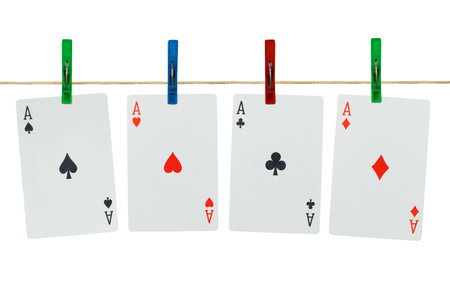 Playing cards on clothespins, isolated on white background
