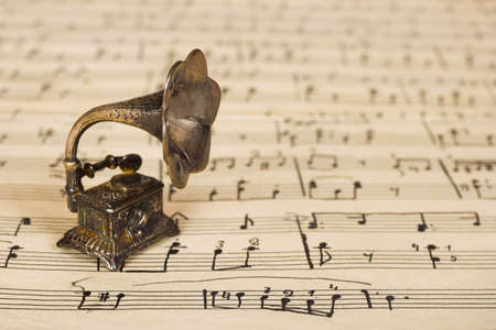 Gramophone on old sheet music, retro art backgroundの写真素材