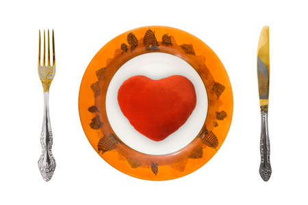 Heart on plate, isolated on white backgroundの写真素材