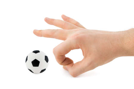 Hand and soccer ball, isolated on white backgroundの写真素材
