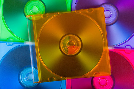 Computer disks in multiciolored boxes, technology background