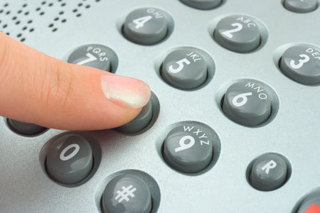Phone keypad and woman finger, abstract communication background