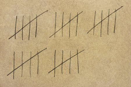 Stone prison wall and numbers, abstract backgroundの写真素材