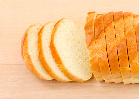 Bread on wood board isolated on white background