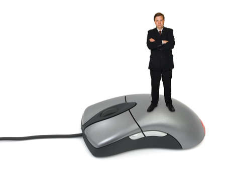 Businessman on computer mouse isolated on white backgroundの写真素材