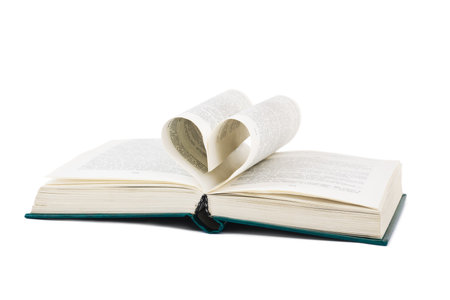 Book and heart shaped pages isolated on white backgroundの写真素材