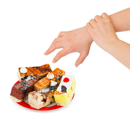 Cakes and hands isolated on white backgroundの写真素材