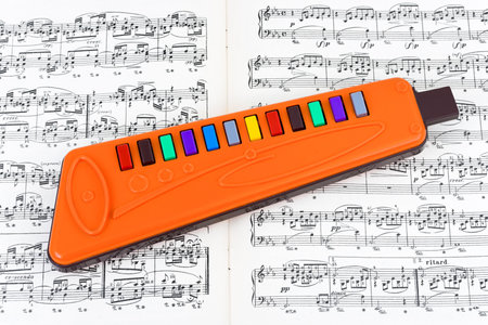 Toy pipe and sheet music, culture education backgroundの写真素材