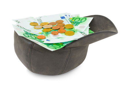 Cap with money isolated on white backgroundの写真素材