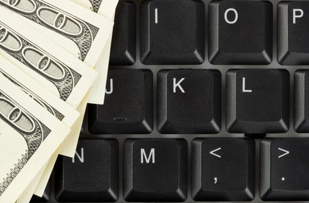 Computer keyboard and money - concept business background