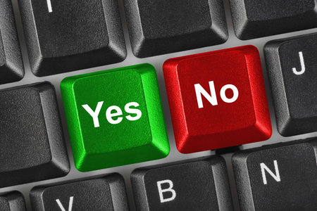 PC keyboard with Yes and No keys - business conceptの写真素材
