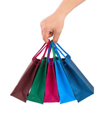 Hand with shopping bags isolated on white backgroundの写真素材