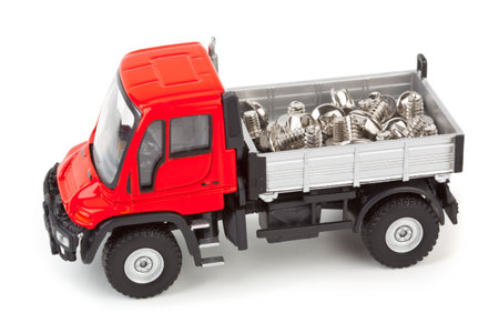 Toy car truck with screws isolated on white backgroundの写真素材