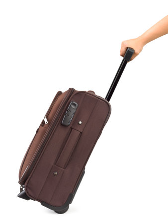 Travel case and hand isolated on white backgroundの写真素材