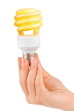 Hand with lighting lamp isolated on white backgroundの写真素材