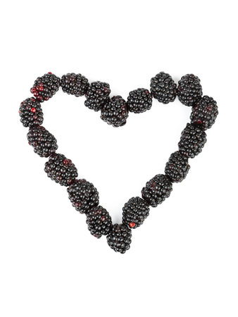 Heart made of blackberry isolated on white backgroundの写真素材