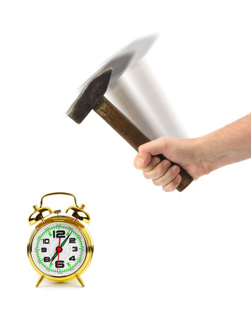 Hand with hammer and alarm clock isolated on white backgroundの写真素材