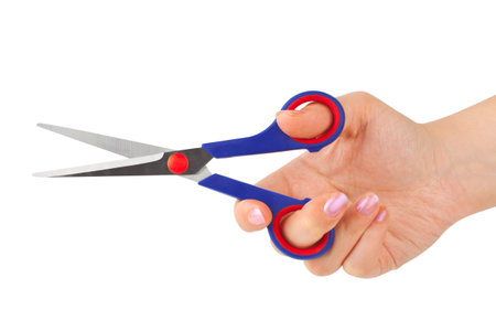 Scissors in hand isolated on white backgroundの写真素材