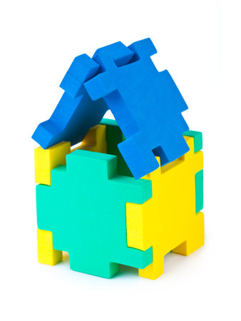 House made of puzzle isolated on white backgroundの写真素材