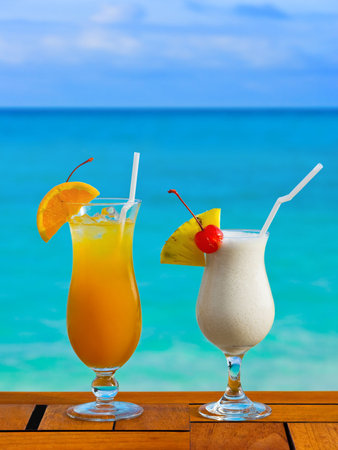 Two cocktails on table at beach cafe - vacation backgroundの写真素材