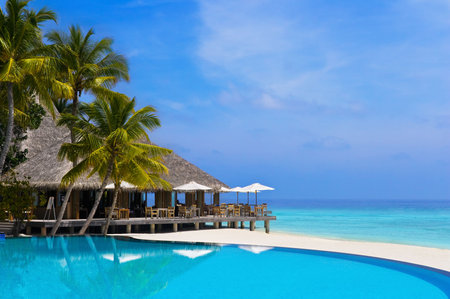 Cafe and pool on a tropical beach - travel backgroundの写真素材