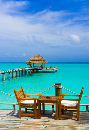 Cafe on the beach, ocean and skyの写真素材