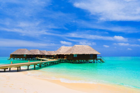 Water bungalows at a tropical island - travel backgroundの写真素材