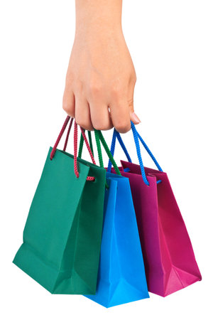 Hand with shopping bags isolated on white backgroundの写真素材