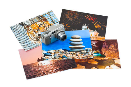 Camera and photo printouts (my photos) isolated on white backgroundの写真素材