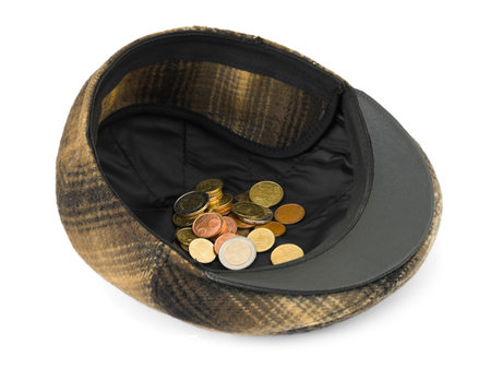 Cap with money isolated on white background