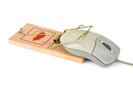 Mousetrap and computer mouse isolated on white backgroundの写真素材