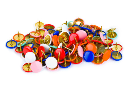 Heap of multicolored pins isolated on white backgroundの写真素材
