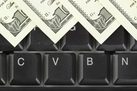 Computer keyboard and money - concept business background