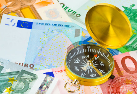 Compass and euro money - business backgroundの写真素材