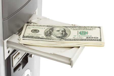 Money and computer isolated on white background