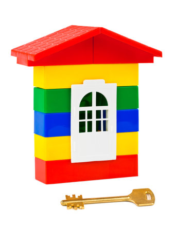 Toy house and key isolated on white backgroundの写真素材