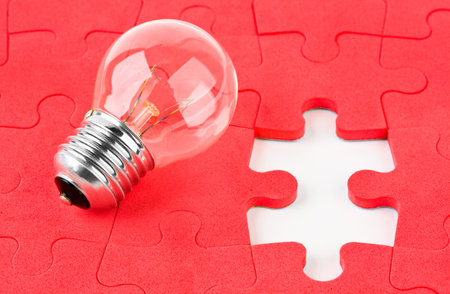 Lamp and red puzzle - concept creativity backgroundの写真素材