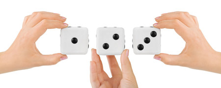Hands and dices isolated on white backgroundの写真素材