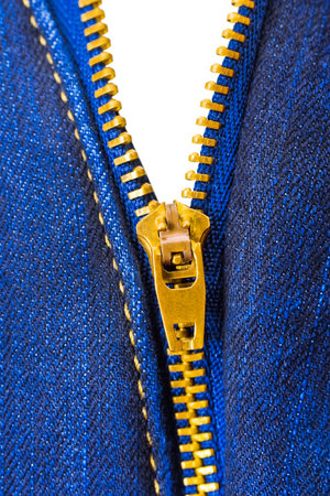 Zipper on denim clothing isolated on white backgroundの写真素材