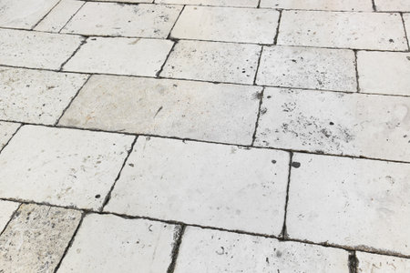 Retro tiled floor on street at Croatia - architecture background