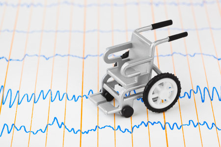 Toy wheelchair on ecg - medical background
