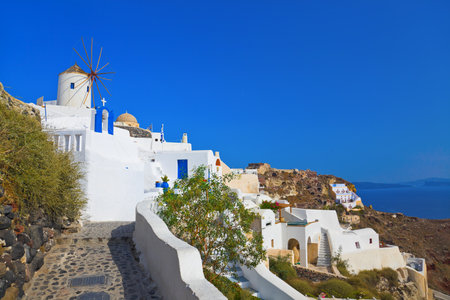 Windmill in Oia at Santorini, Greece - vacation backgroundの写真素材